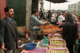 Algerians of the Badjarah district of Algiers go shopping in preparation for the holy month of Ramadan, Tuesday Dec. 30, 1997.  Road-side attackers and village raiders wielding knives and guns killed 58 people in Algeria in recent days according to witnesses and newspaper reports Tuesday. (AP PHOTO)
