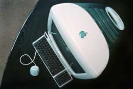 Apple's new iMAC computer is seen Wednesday, Aug. 13, 1998, at Apple headquarters in Cupertino, Calif. The latest Macintosh goes on sale Saturday for $1,299.00, amid high demand from loyal Mac users. Apple said it has received more than 150,000 advance orders the first week it began accepting requests. (AP Photo/Ben Margot)