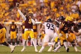 TEMPE, AZ - NOVEMBER 25:  Quarterback Manny Wilkins #5 of the Arizona State Sun Devils throws a deep pass during the second half of the college football game against the Arizona Wildcats at Sun Devil Stadium on November 25, 2017 in Tempe, Arizona.  The Sun Devils defeated the Wildcats 42-30.  (Photo by Christian Petersen/Getty Images)