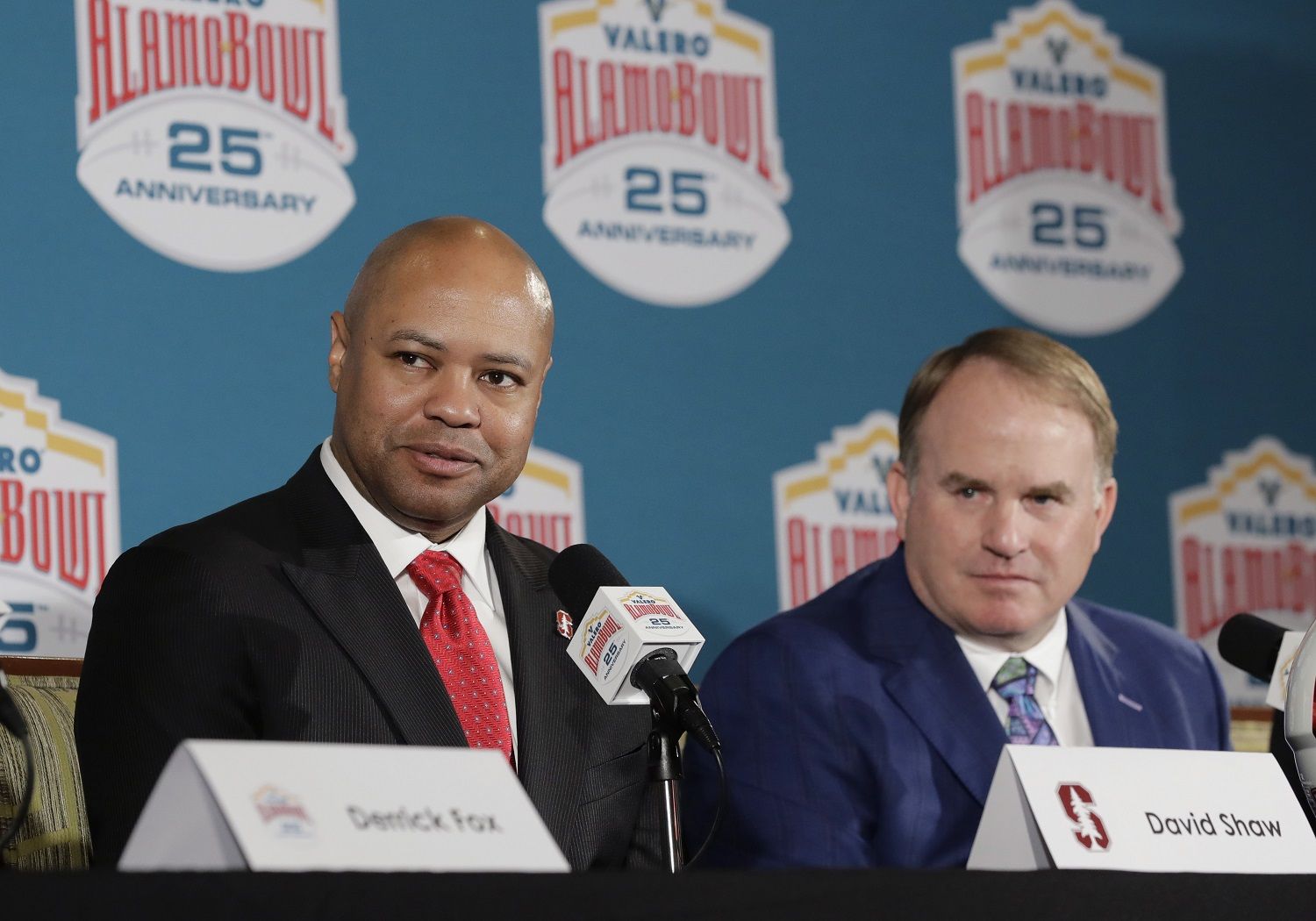 Stanford head coach David Shaw, left, and TCU head coach Gary Patterson, right, take part in a news conference for the Alamo Bowl NCAA college football game, Thursday, Dec. 7, 2017, in San Antonio. TCU and Stanford will play in the Alamo Bowl on Dec. 28. (AP Photo/Eric Gay)
