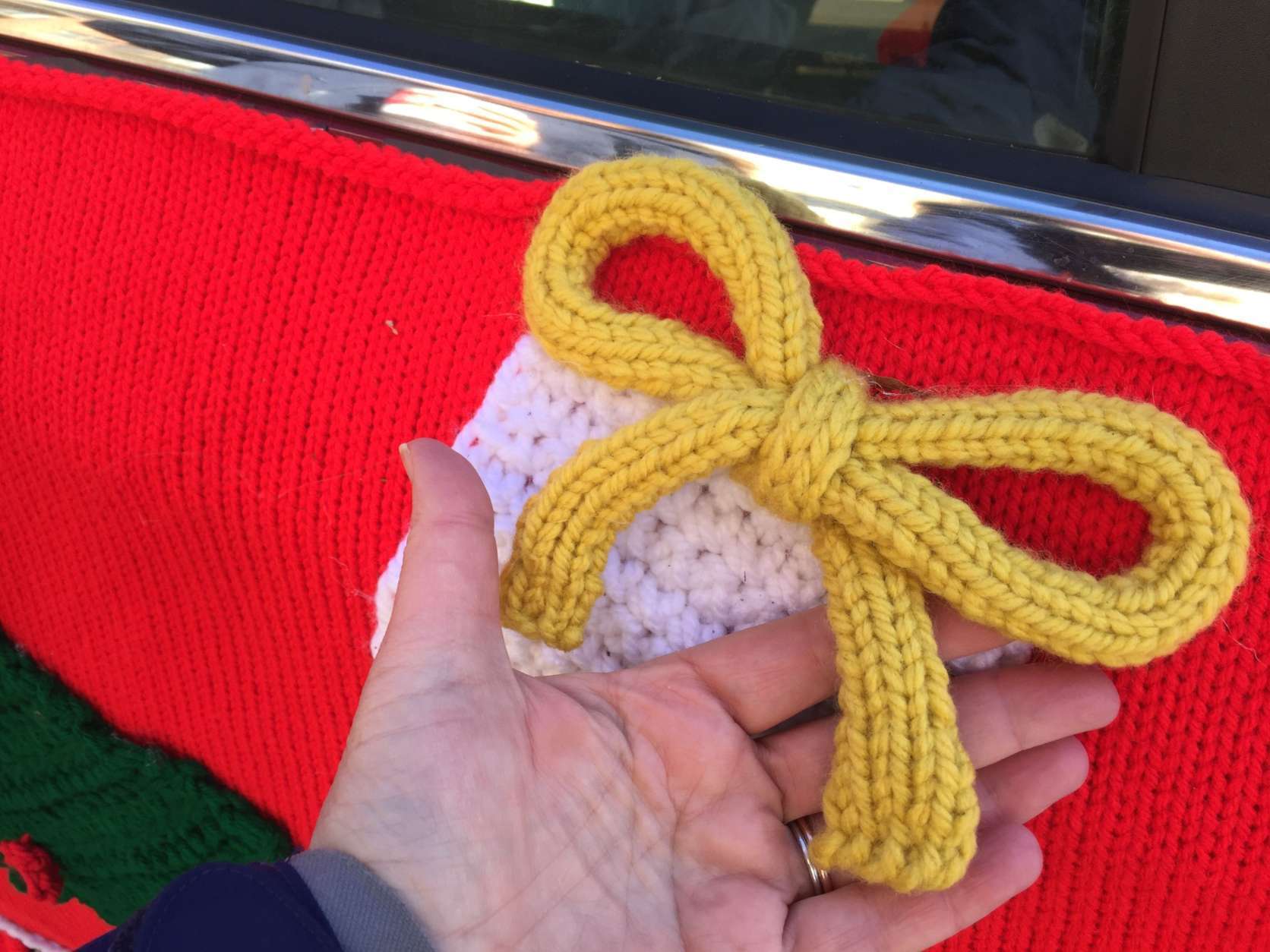 Sweater-bombed Lyft cars are covered from hood to trunk with an actual sweater. (WTOP/Kristi King)