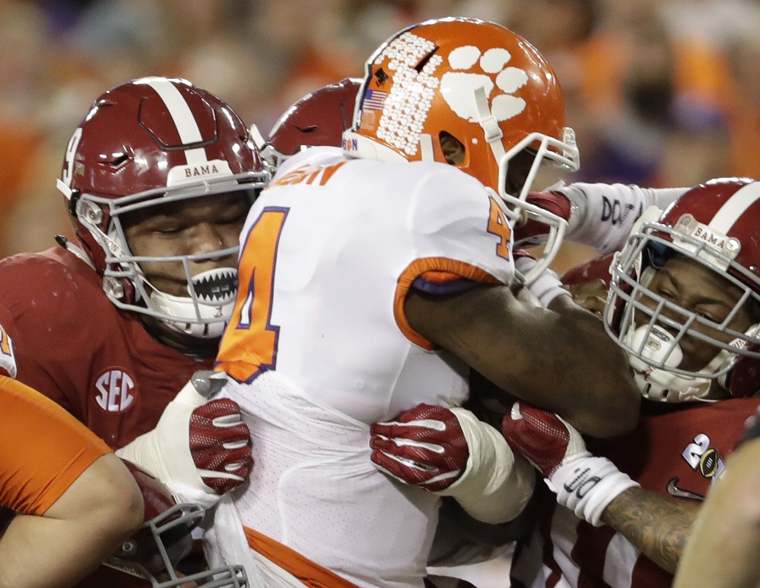 Clemson's Deshaun Watson is stopped on a third down run during the first half of the NCAA college football playoff championship game against Alabama Monday, Jan. 9, 2017, in Tampa, Fla. (AP Photo/David J. Phillip)
