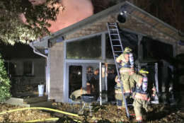 Montgomery County firefighters put out a fire that broke out in a house on Brink Road, Thursday, Dec. 21, 2017. (Courtesy Montgomery County Fire & Rescue)