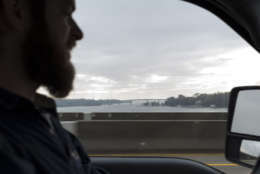 Wayne Witzke from the Shell Recycling Alliance drives the organization’s truck Nov. 9 across the Severn River Bridge in Anne Arundel County, Md. Witzke and his colleagues recycle shell to bolster state and federally sponsored, large-scale oyster restoration in Chesapeake Bay tributaries. (Alex Mann/Capital News Service)