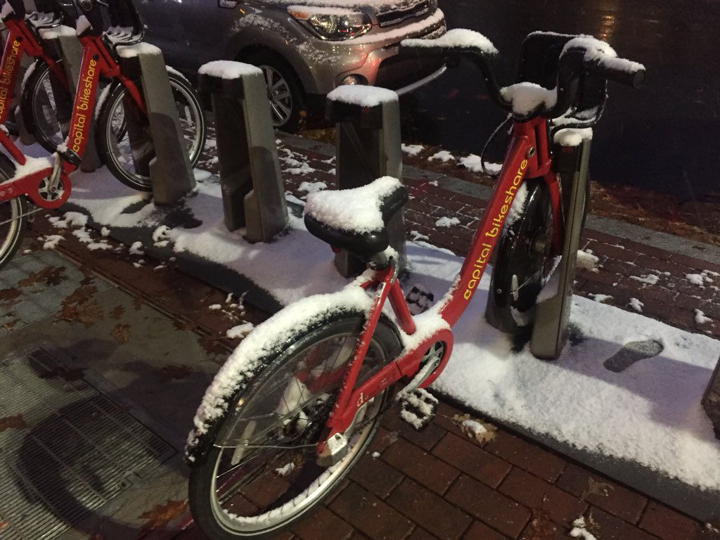 A snow covered bike at a Capital Bikeshare dock on Wisconsin Avenue in D.C. (WTOP/Patrick Roth)