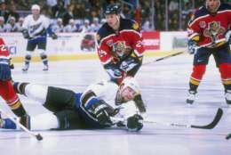 5 Dec 1997:  Chris Simon #17 of the Washington Capitals dives on the ice to shoot during the Capitals 3-2 win over the Florida Panthers at the MCI Center in Washington, D.C. Mandatory Credit: Doug Pensinger  /Allsport