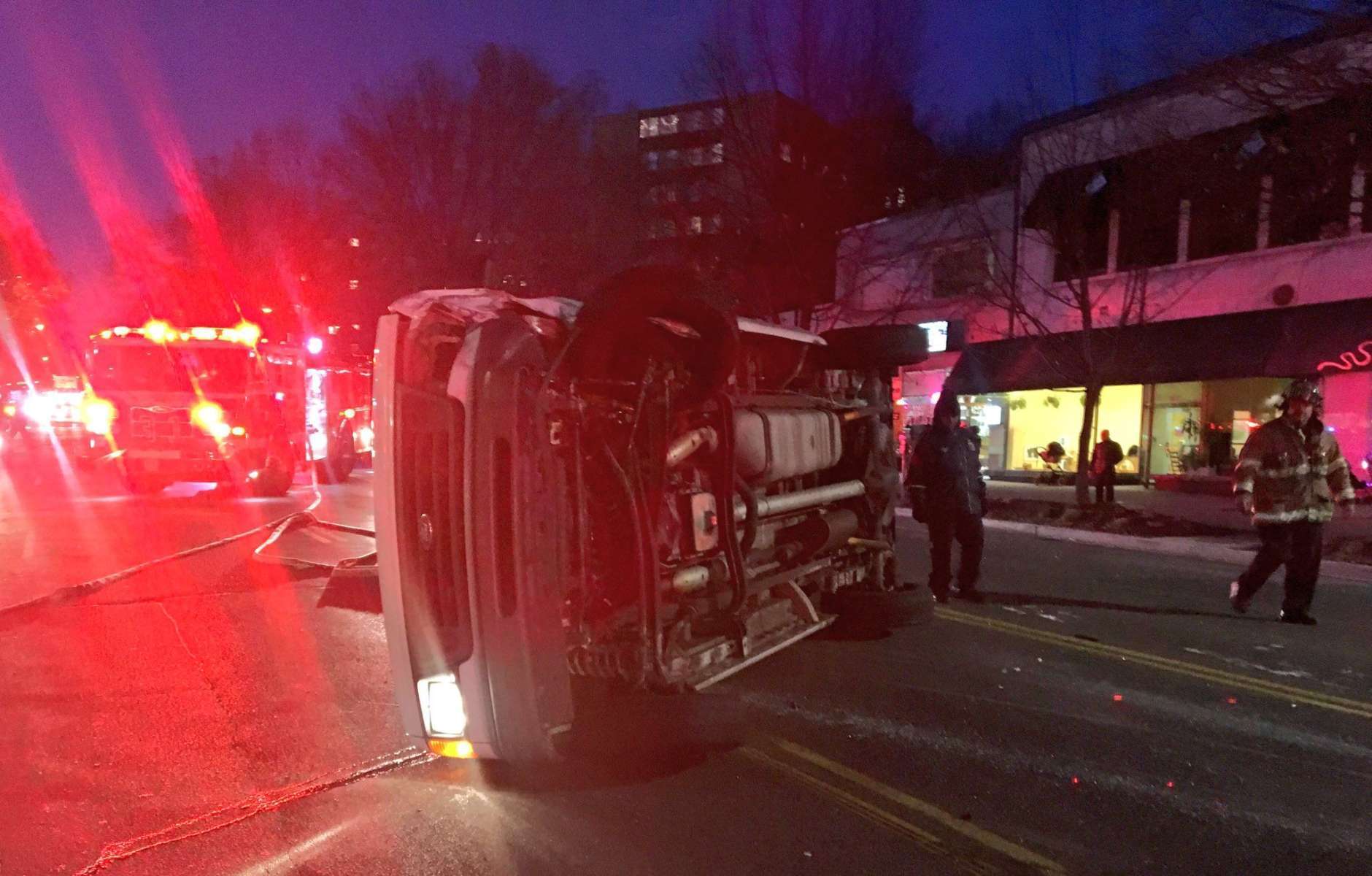 One person was in serious condition following a 4-vehicle crash that left one car overturned in Northwest D.C. Friday evening. (Courtesy D.C. Fire and EMS)
