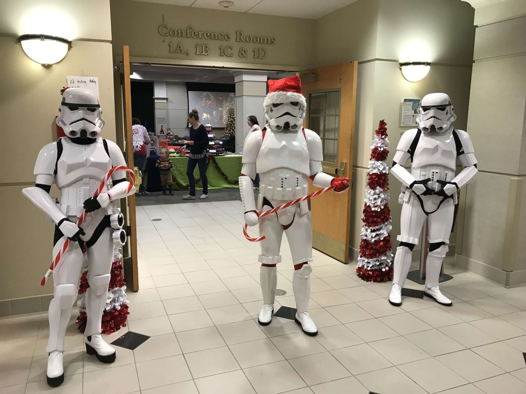 Three Stormtroopers guard a doorway at the party. A few came armed with giant candy canes in place of blasters.
 (WTOP/Michelle Basch)