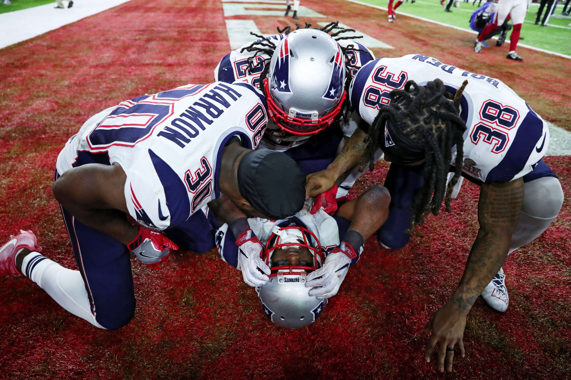 HOUSTON, TX - FEBRUARY 05:  James White #28 of the New England Patriots celebrates with teammates after defeating the Atlanta Falcons 34-28 in overtime to win Super Bowl 51 at NRG Stadium on February 5, 2017 in Houston, Texas.  (Photo by Tom Pennington/Getty Images)