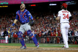 WASHINGTON, DC - OCTOBER 13:  Willson Contreras #40 of the Chicago Cubs celebrates next to Bryce Harper #34 of the Washington Nationals after Harper struck out to end Game 5 of the National League Divisional Series at Nationals Park on October 13, 2017 in Washington, DC. The Cubs won the game 9-8 and will advance to the National League Championship Series against the Los Angeles Dodgers.
 (Photo by Win McNamee/Getty Images)