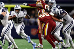 ARLINGTON, TX - NOVEMBER 30:  Alfred Morris #46 of the Dallas Cowboys tries to evade Ziggy Hood #90 of the Washington Redskins and Zach Vigil #56 of the Washington Redskins on a carry in the first half of a football game at AT&amp;T Stadium on November 30, 2017 in Arlington, Texas.  (Photo by Wesley Hitt/Getty Images)