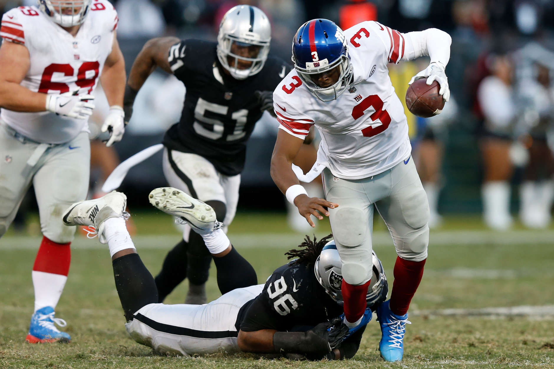 OAKLAND, CA - DECEMBER 03:  Denico Autry #96 of the Oakland Raiders sacks Geno Smith #3 of the New York Giants during their NFL game at Oakland-Alameda County Coliseum on December 3, 2017 in Oakland, California.  (Photo by Lachlan Cunningham/Getty Images)