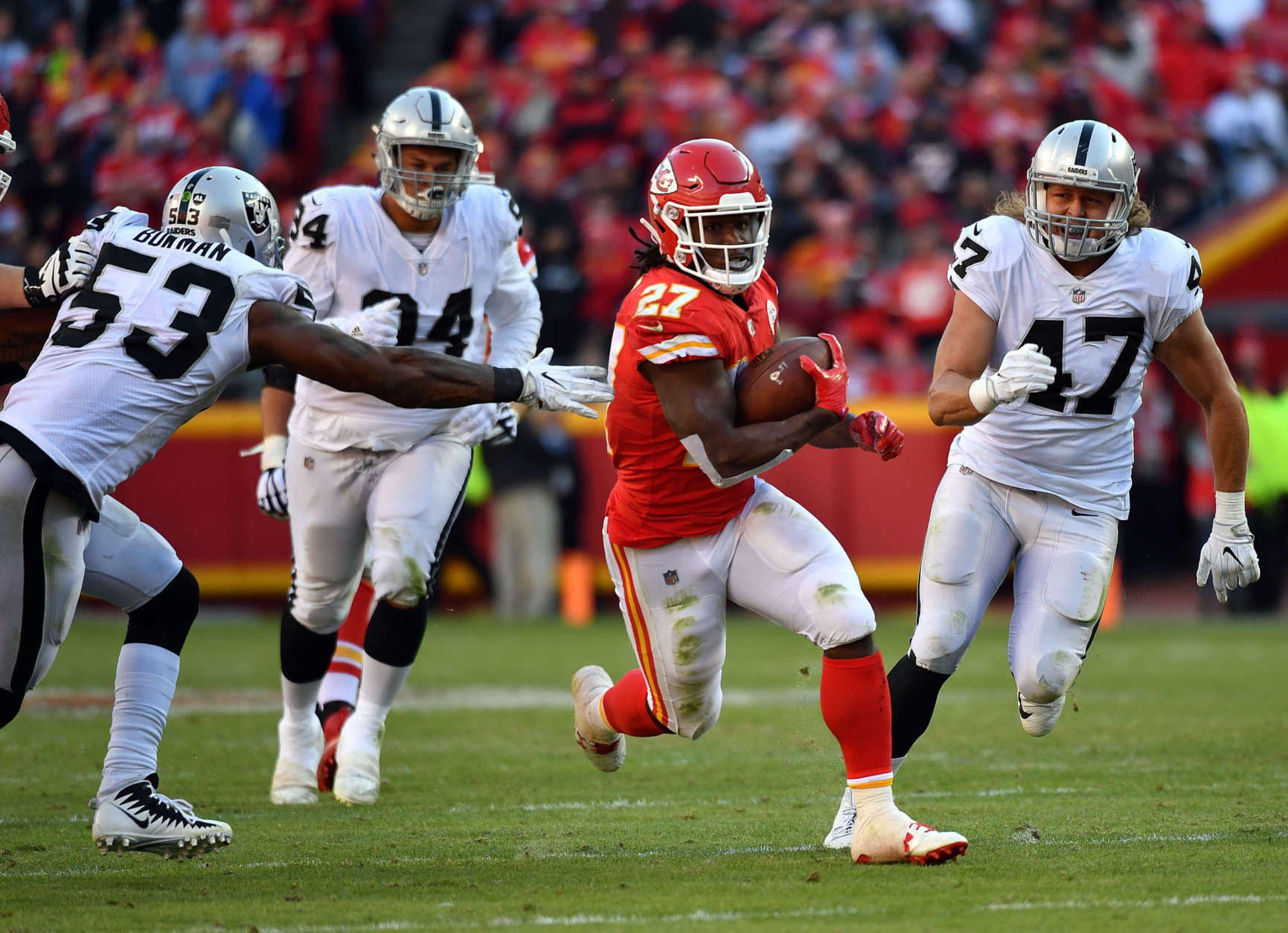 KANSAS CITY, MO - DECEMBER 10:  Running back Kareem Hunt #27 of the Kansas City Chiefs carries the ball during the game against the Oakland Raiders at Arrowhead Stadium on December 10, 2017 in Kansas City, Missouri.  (Photo by Peter Aiken/Getty Images)