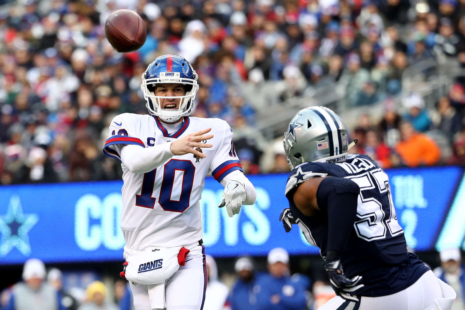 EAST RUTHERFORD, NEW JERSEY - DECEMBER 10:  Eli Manning #10 of the New York Giants throws a pass against the Dallas Cowboys during the second quarter in the game at MetLife Stadium on December 10, 2017 in East Rutherford, New Jersey. (Photo by Elsa/Getty Images)