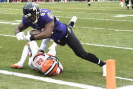 CLEVELAND, OH - DECEMBER 17: Benjamin Watson #82 of the Baltimore Ravens dives over Jabrill Peppers #22 of the Cleveland Browns to score a touchdown in the second quarter at FirstEnergy Stadium on December 17, 2017 in Cleveland, Ohio. (Photo by Jason Miller/Getty Images)