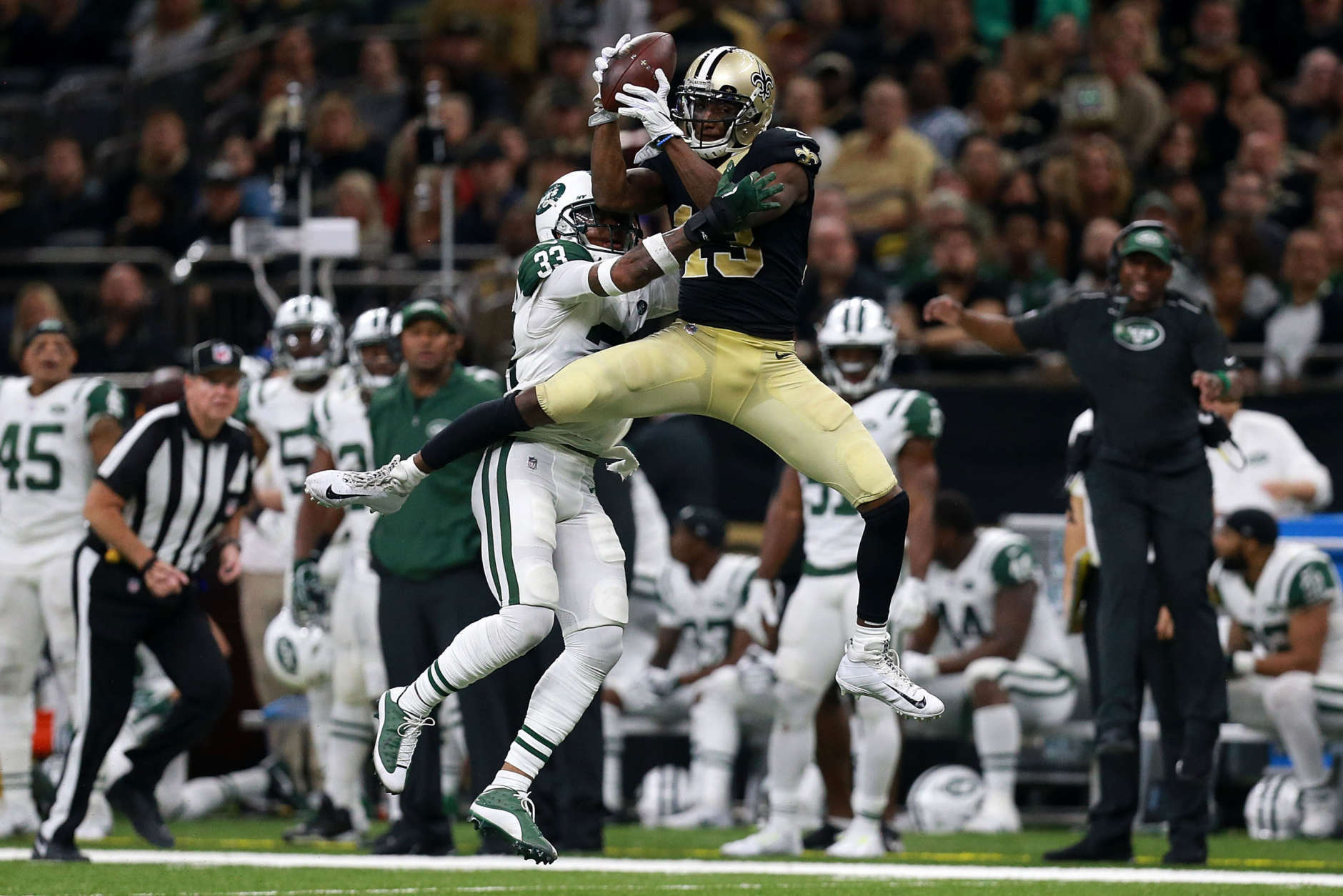 NEW ORLEANS, LA - DECEMBER 17:  Wide receiver Michael Thomas #13 of the New Orleans Saints catches the ball over strong safety Jamal Adams #33 of the New York Jets during the second half of a game at the Mercedes-Benz Superdome on December 17, 2017 in New Orleans, Louisiana.  (Photo by Sean Gardner/Getty Images)