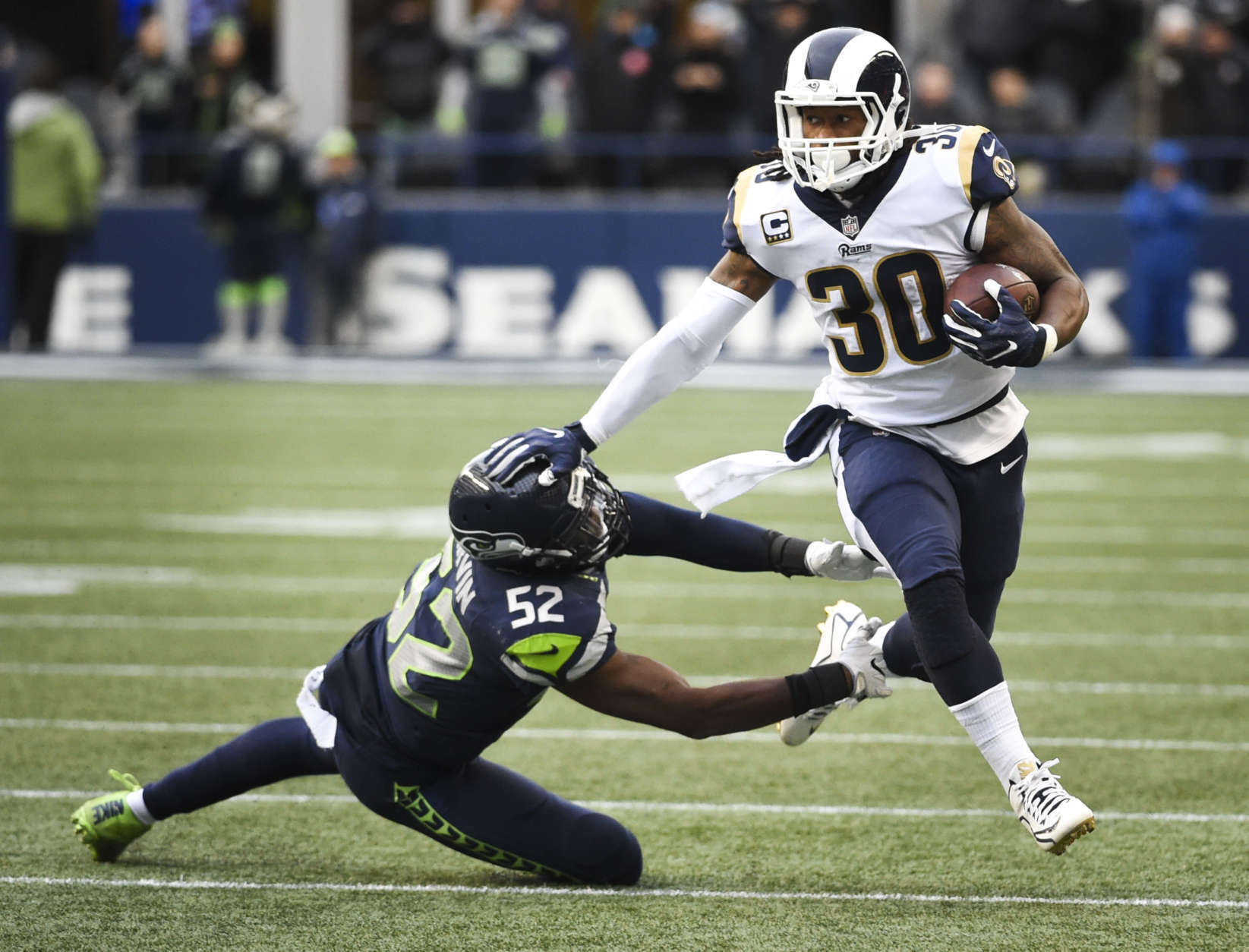 SEATTLE, WA - DECEMBER 17:  Running back Todd Gurley #30 of the Los Angeles Rams is tackled by linebacker Terence Garvin #52 of the Seattle Seahawks during the 2nd quarter of the game at CenturyLink Field on December 17, 2017 in Seattle, Washington.  (Photo by Steve Dykes/Getty Images)
