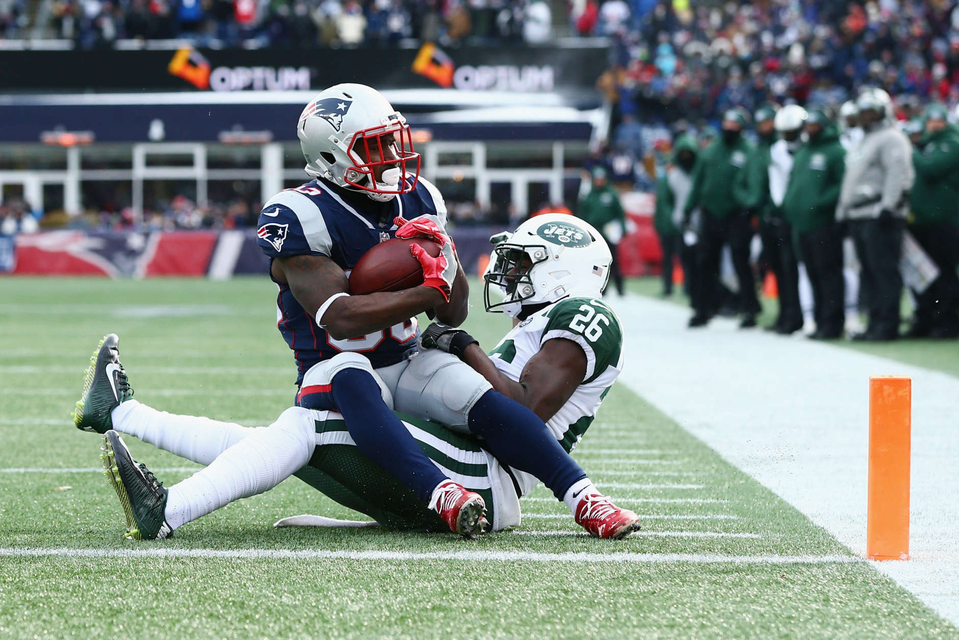 FOXBORO, MA - DECEMBER 31:  Dion Lewis #33 of the New England Patriots rushes for a 3-yard touchdown as Marcus Maye #26 of the New York Jets attempts to tackle him during the first quarter at Gillette Stadium on December 31, 2017 in Foxboro, Massachusetts.  (Photo by Maddie Meyer/Getty Images)