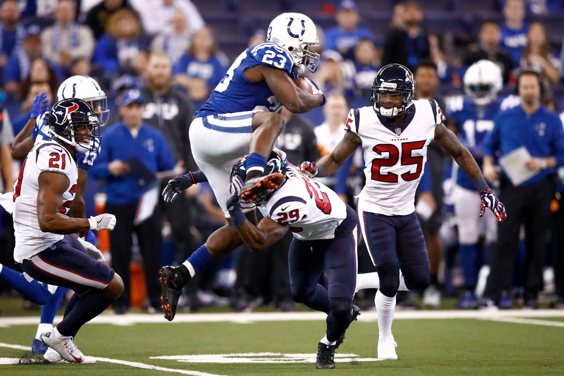 INDIANAPOLIS, IN - DECEMBER 31:  Frank Gore #23 of the Indianapolis Colts jumps over Andre Hal #29 of the Houston Texans during the second half at Lucas Oil Stadium on December 31, 2017 in Indianapolis, Indiana.  (Photo by Andy Lyons/Getty Images)
