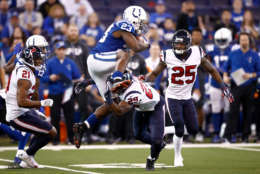 INDIANAPOLIS, IN - DECEMBER 31:  Frank Gore #23 of the Indianapolis Colts jumps over Andre Hal #29 of the Houston Texans during the second half at Lucas Oil Stadium on December 31, 2017 in Indianapolis, Indiana.  (Photo by Andy Lyons/Getty Images)