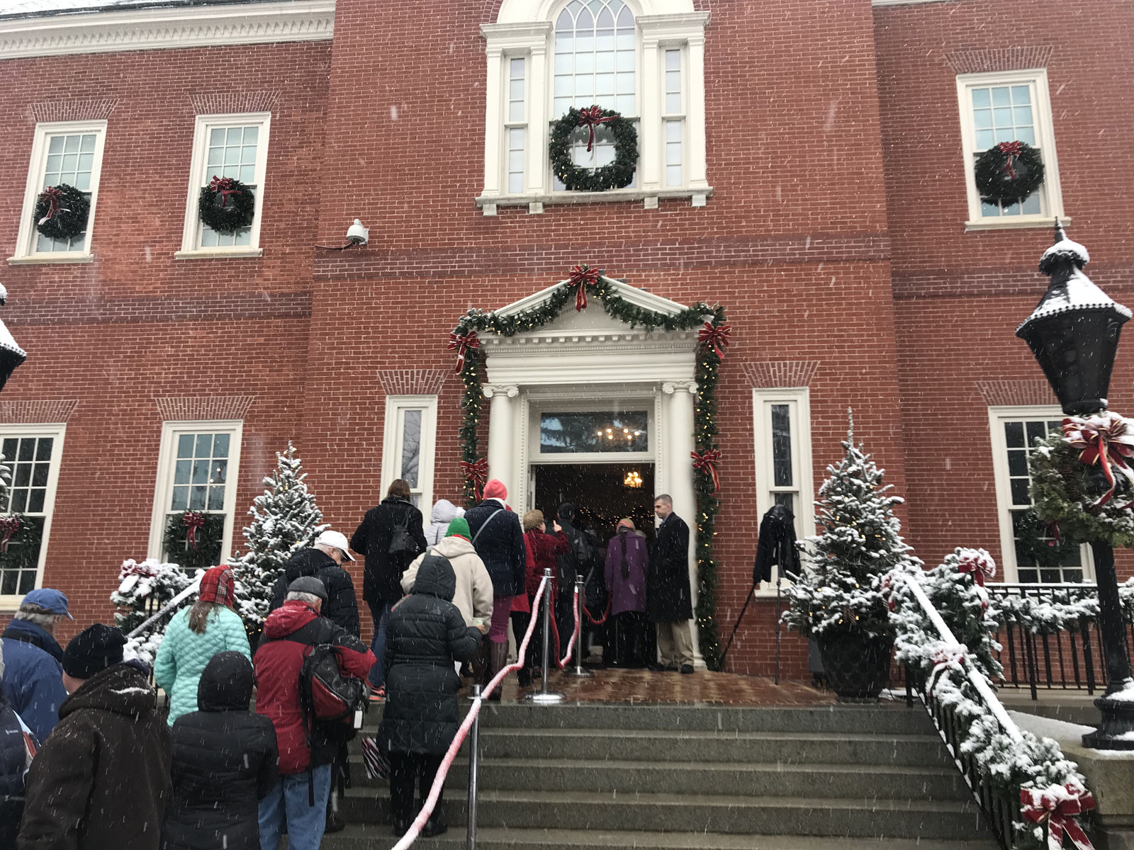 Guests wait outside the Government House, an 1870 Georgian-style mansion that serves as the Governor's Mansion in Annapolis, Maryland. (WTOP/Dick Uliano)