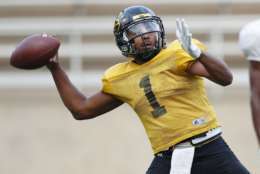 Grambling's senior quarterback Devante Kincade (1) sets to pass during practice, Thursday, Nov. 16, 2017, at Eddie G. Robinson Memorial Stadium in Grambling, La. Kincade, who played two seasons at Ole Miss, says playing football at a Historically Black College or University is an experience to savor. Playing at an HBCU is not just about entertaining halftime shows the schools are known for, it's about community. (AP Photo/Rogelio V. Solis)