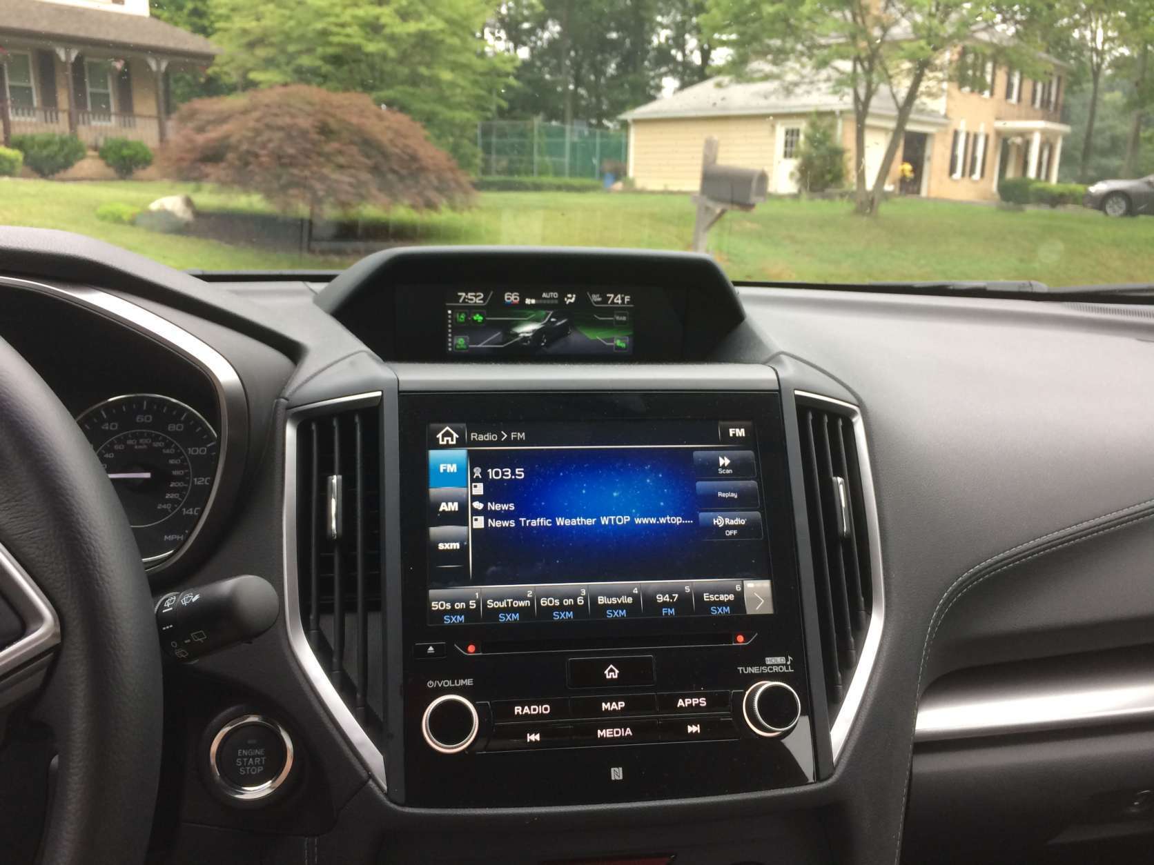 The car came equipped with the optional NAV and Harmon Kardon audio. The 8-inch touchscreen was easy to use. There is a second small screen in a pod on top of the dash with climate controls and other functions. (WTOP/Mike Parris) 