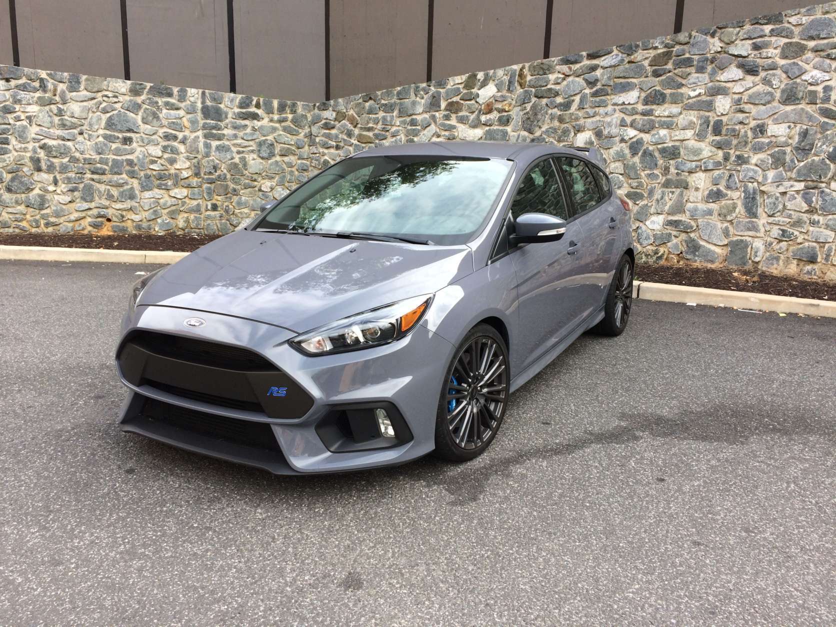The Focus RS has a look that screams that it’s a hot hatch right from its unique and stand-out stealth gray color. There is a unique front grill that looks racy; the fog lights are placed into vents.  (WTOP/Mike Parris)