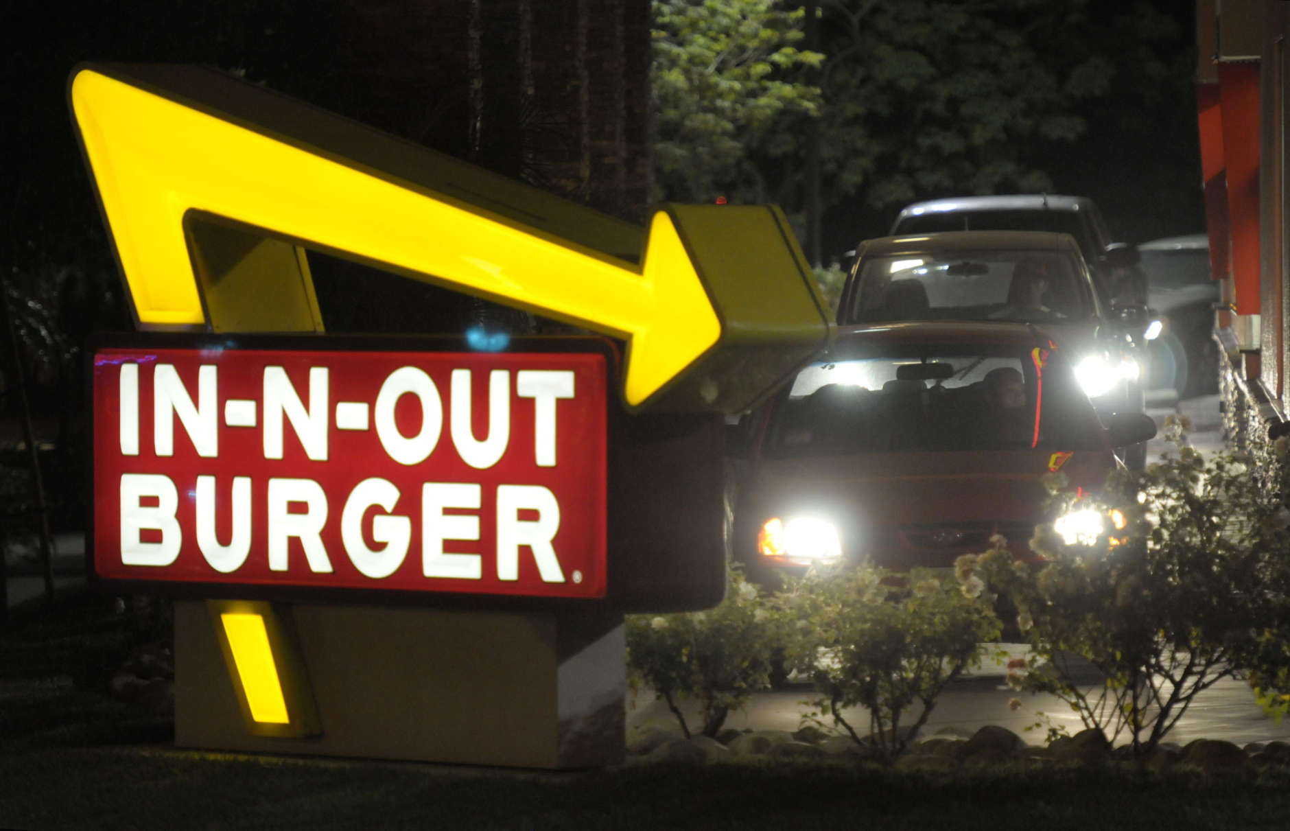 Cars line up in the drive-thru at In-N-Out Burger on Tuesday, June 8, 2010, in Baldwin Park, Calif. (AP Photo/Adam Lau)