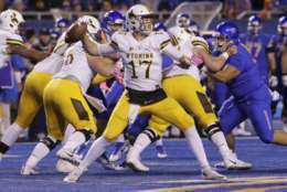 Wyoming quarterback Josh Allen (17) passes the ball during the first half of an NCAA college football game against Boise State in Boise, Idaho, on Saturday, Oct. 21, 2017. (AP Photo/Otto Kitsinger)