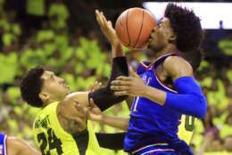 WACO, TX - FEBRUARY 18: Josh Jackson #11 of the Kansas Jayhawks has the ball deflect off his face as Ishmail Wainright #24 of the Baylor Bears defends in the second half at the Ferrell Center on February 18, 2017 in Waco, Texas. Kansas won 67-65. (Photo by Ron Jenkins/Getty Images)