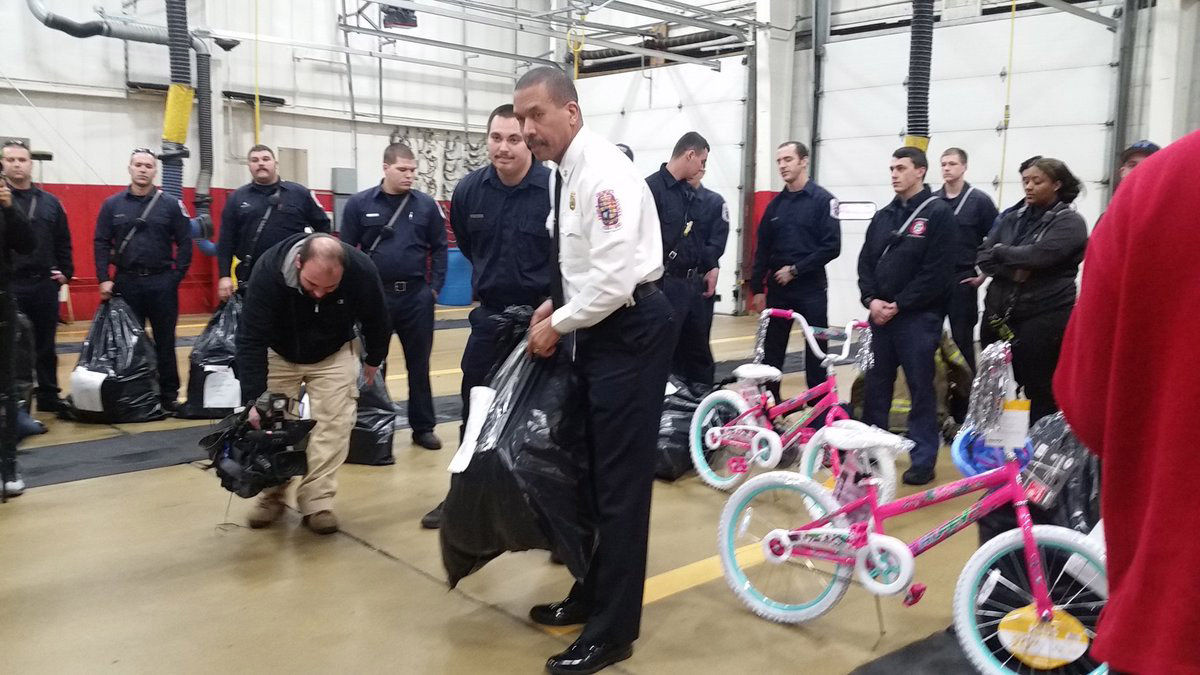 Prince George's County fire chief, firefighters Toys for Tots and the Red Cross helping make Christmas a little brighter. (WTOP/Kathy Stewart)