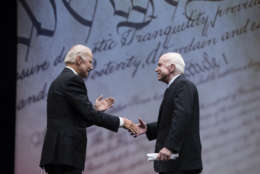 Sen. John McCain, R-Ariz., shakes hands with chair of the National Constitution Center's Board of Trustees, former Vice President Joe Biden after receiving the Liberty Medal in Philadelphia, Monday, Oct. 16, 2017. The honor is given annually to an individual who displays courage and conviction while striving to secure liberty for people worldwide. (AP Photo/Matt Rourke)
