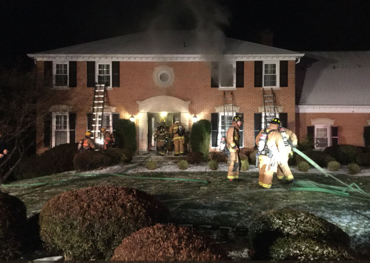 Montgomery County firefigthers respond to a fire in a two-story house on Earlsgate Lane in Rockville on Saturday, Dec. 30, 2017. (Courtesy Montgomery County Fire & Rescue)