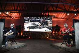 IMAGE DISTRIBUTED FOR NBA 2K - Team GFG, right, and team Drewkerbockers, left, seen at the NBA 2K16 Road to the Finals championship event on Wednesday, June 1, 2016, in Los Angeles. Two teams of gamers go head to head during a competition that merges simulation basketball with eSports for a shot at $250,000 and a trip to the 2015-2016 NBA Finals. (Photo by Dan Steinberg/Invision for NBA 2K/AP Images)