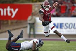 New Mexico State wide receiver Gregory Hogan (7) avoids the tackle attempt by South Alabama safety Nigel Lawrence (6) during the first half of an NCAA college football game in Las Cruces, N.M., Saturday, Dec. 2, 2017. (AP Photo/Andres Leighton)