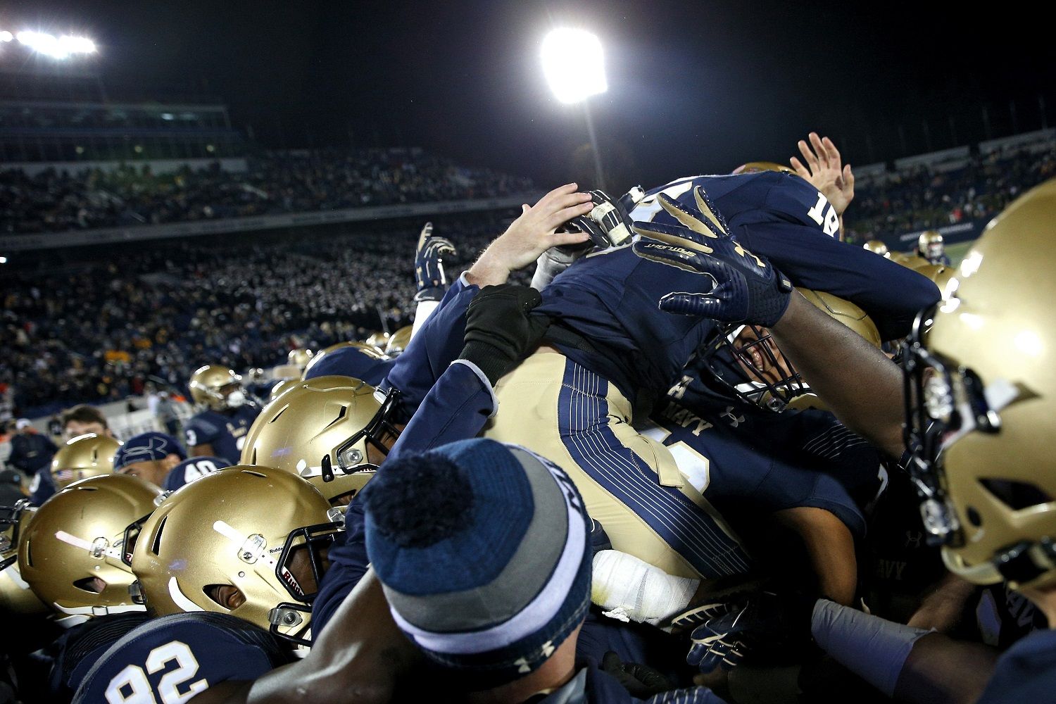ANNAPOLIS, MD - NOVEMBER 11: Place kicker J.R. Osborn #18 of the Navy Midshipmen celebrates with teammates after kicking the game-winning field goal against the Southern Methodist Mustangs as time expired in the fourth quarter to win, 43-40, at Navy-Marines Memorial Stadium on November 11, 2017 in Annapolis, Maryland. (Photo by Patrick Smith/Getty Images)