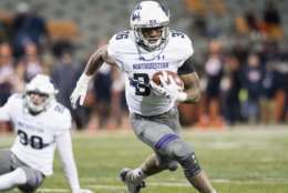 Northwestern running back Jesse Brown (36) runs the ball on his way to a touchdown during the fourth quarter of an NCAA college football game against Illinois Saturday, Nov. 25, 2017 at Memorial Stadium in Champaign, Ill. Northwestern defeated Illinois 42-7. (AP Photo/Bradley Leeb)