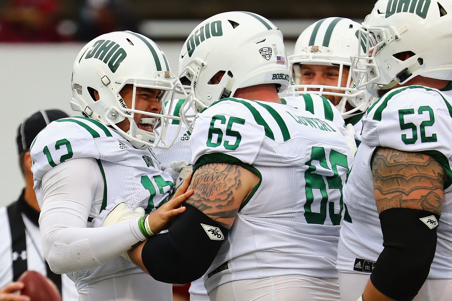 HADLEY, MA - SEPTEMBER 30:  Nathan Rourke #12 of the Ohio Bobcats celebrates with Joe Lowery #65 after scoring a touchdown during the second quarter against the Massachusetts Minutemen at Warren McGuirk Alumni Stadium on September 30, 2017 in Hadley, Massachusetts.  (Photo by Tim Bradbury/Getty Images)