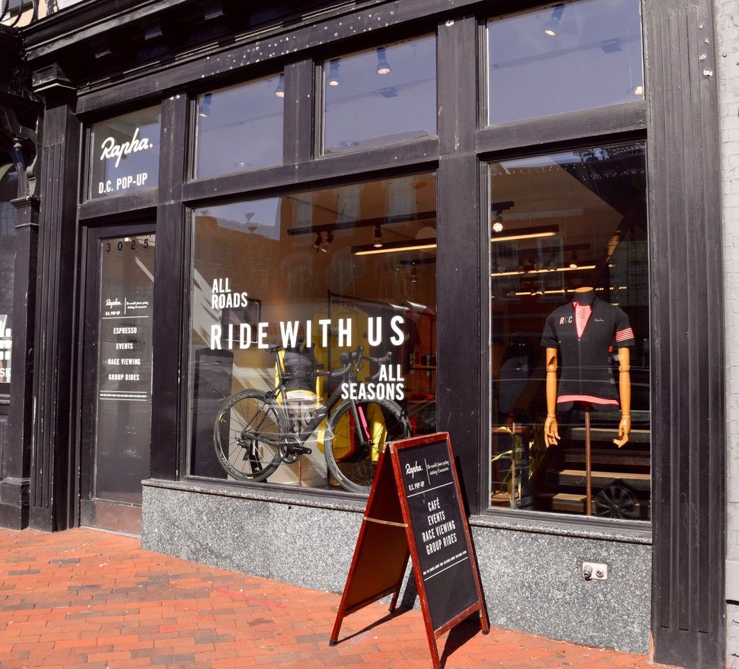 Cycling clothing and accessory retailer Rapha's pop-up Clubhouse at 3025 M Street, NW will be open through at least February. (EastBanc Inc., Jamestown LP and Acadia Realty Trust)