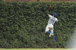 CHICAGO, IL - AUGUST 20:  Kevin Pillar #11 of the Toronto Blue Jays fields a fly ball off the center field wall during the eighth inning of a game against the Chicago Cubs at Wrigley Field on August 20, 2017 in Chicago, Illinois.  (Photo by Stacy Revere/Getty Images)