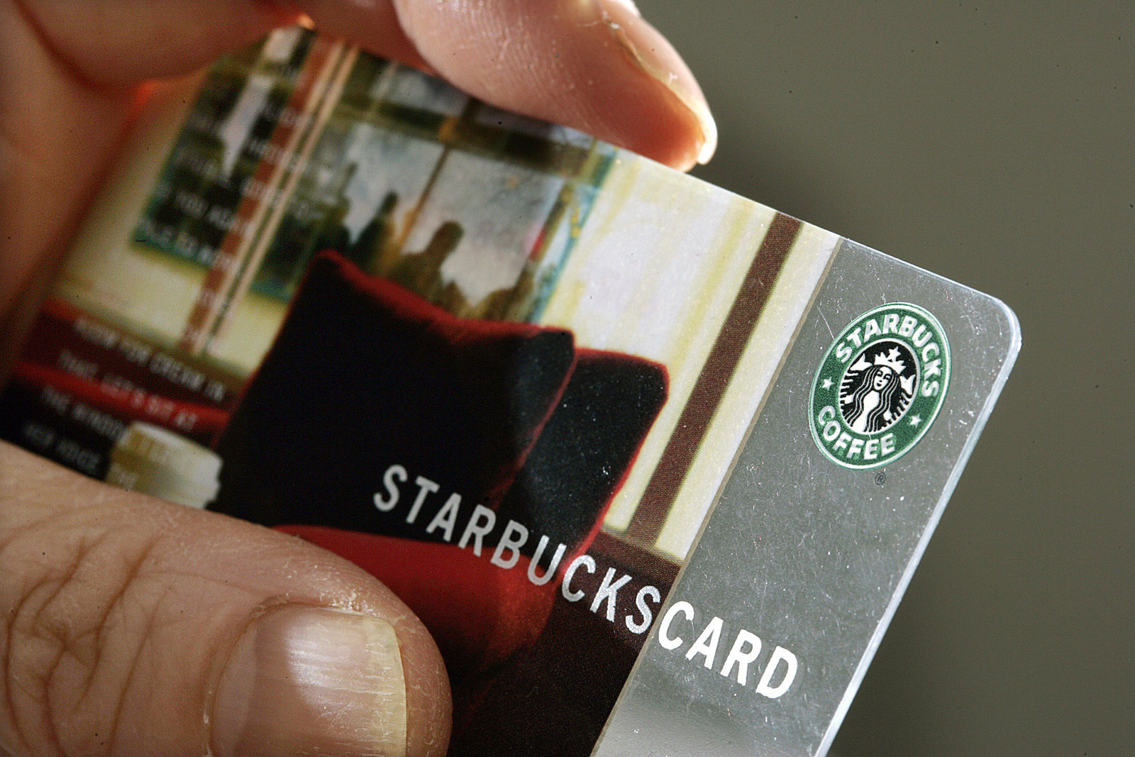 A person holds a Starbucks Coffee card Wednesday, Nov. 31, 2007 in  Pennington, N.J.   (AP Photo/Mel Evans)