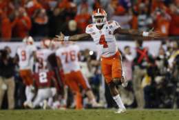 FILE - In this Jan. 10, 2017, file photo, Clemson's Deshaun Watson celebrates a last second touchdown pass to Hunter Renfrow in the second half of the NCAA college football playoff championship game against Alabama in Tampa, Fla. The Palmetto State is sitting atop the college sports landscape when it comes to yearlong success. Clemson won the national football title in January while Coastal Carolina won the College World Series last summer. Now, both the South Carolina men’s and women’s basketball teams are in the Final Four this weekend looking to bring more championships to the state. (AP Photo/John Bazemore, File)
