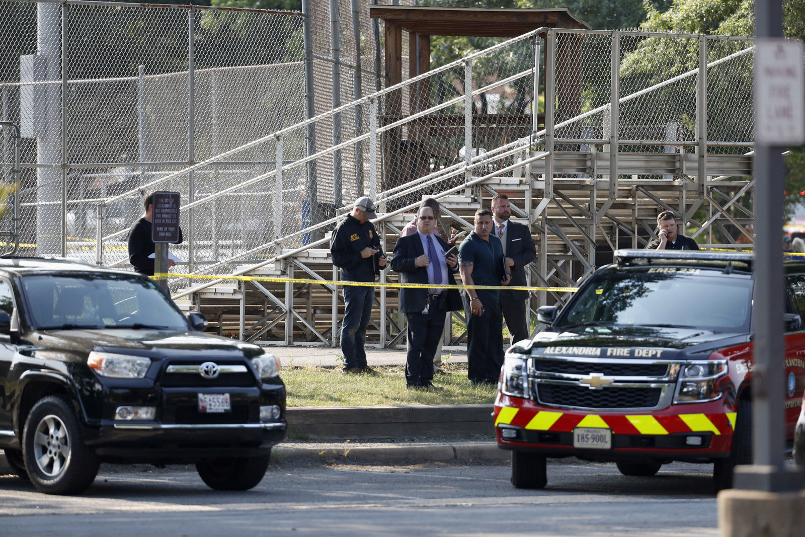 Law enforcement officers investigate the scene of a shooting near a baseball field in Alexandria, Va., Wednesday, June 14, 2017, where House Majority Whip Steve Scalise of La. was shot at a Congressional baseball practice. (AP Photo/Alex Brandon)