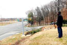 In Dec. 2017, Derrick Butler watched as D.C. police searched near I-95 in Stafford County for the remains of his sister, Pamela, who was murdered in 2009. (WTOP/Neal Augenstein)