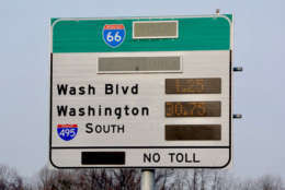 A sign shows an I-66 toll of $30.25.