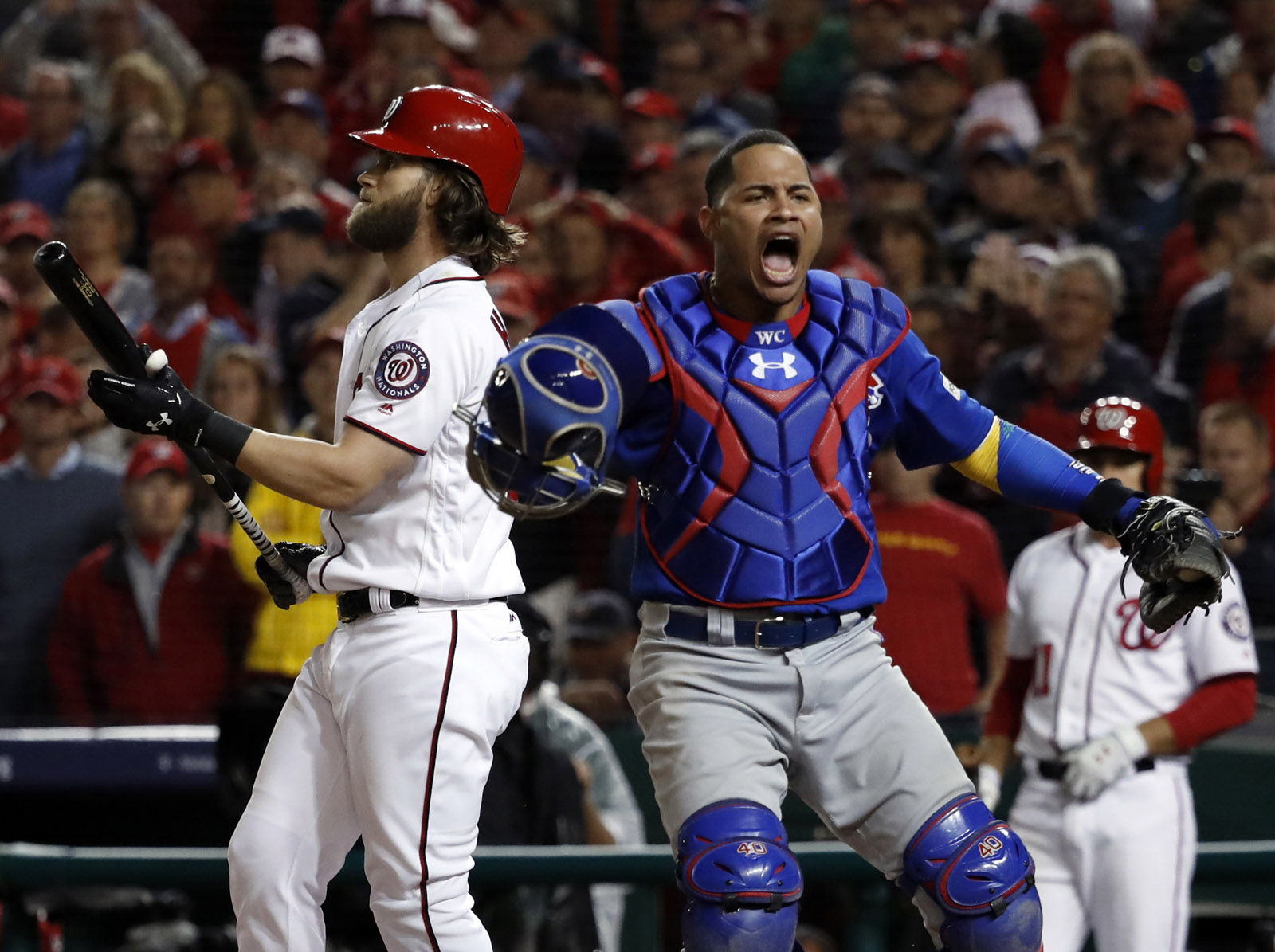 Chicago Cubs catcher Willson Contreras (40) reacts after Washington Nationals' Bryce Harper struck out for the final out as the Cubs beat the Washington Nationals 9-8 to to win baseball's National League Division Series, at Nationals Park, early Friday, Oct. 13, 2017, in Washington. (AP Photo/Pablo Martinez Monsivais)