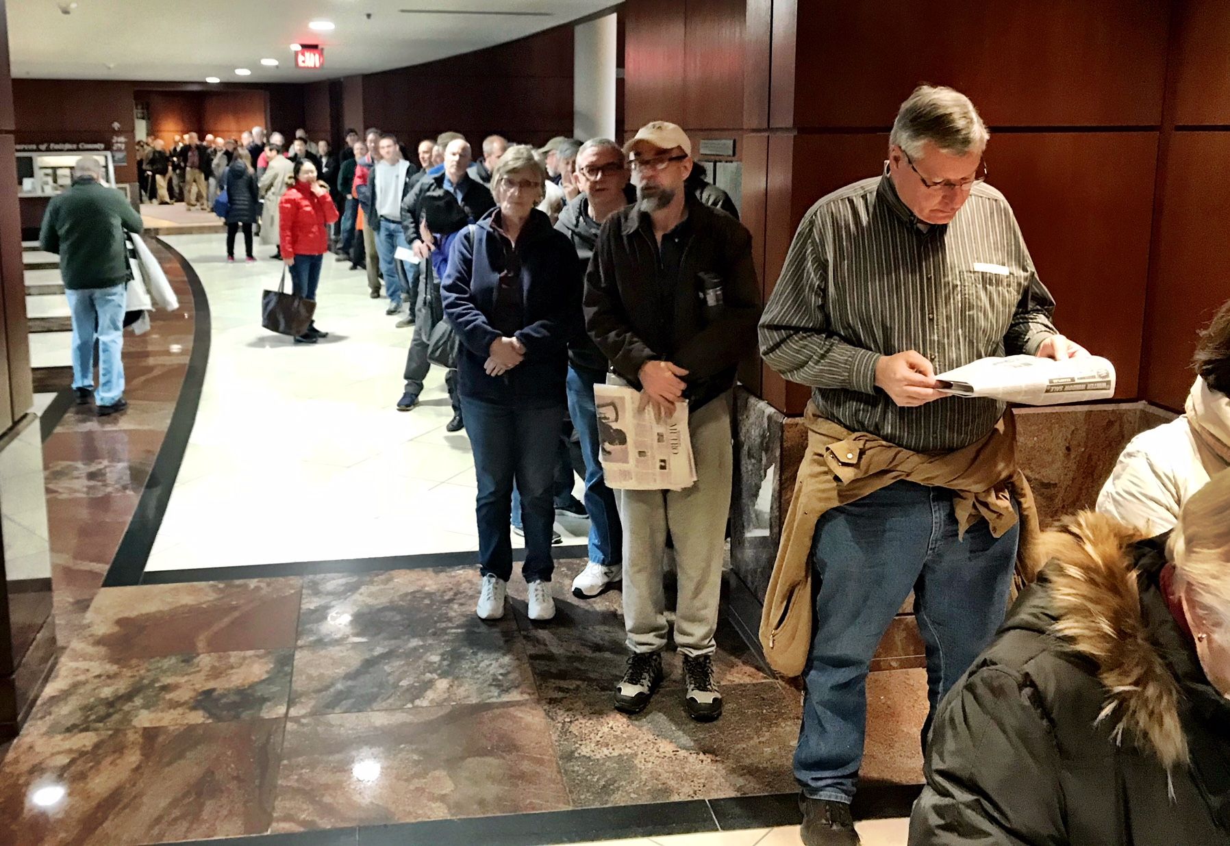 Fairfax County taxpayers stand in line to prepay property taxes, ahead of the new 2018 tax laws. (WTOP/Neal Augenstein)
