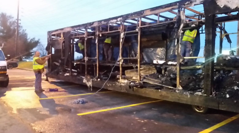 A package loading work trailer is destroyed after Monday's fire. (WTOP/Kathy Stewart)