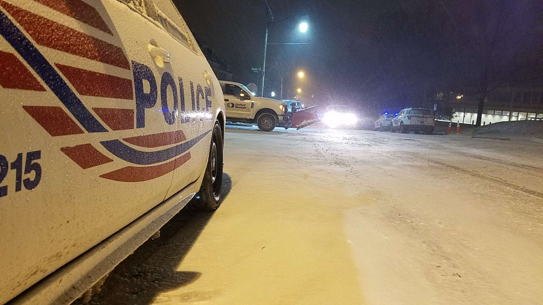 Snow coats a police cruiser in Northwest D.C. Thursday morning. (WTOP/William Vitka)
